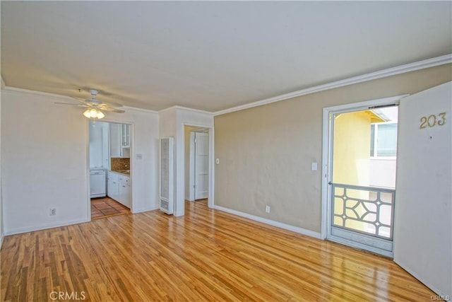 unfurnished room featuring light hardwood / wood-style floors, crown molding, and ceiling fan