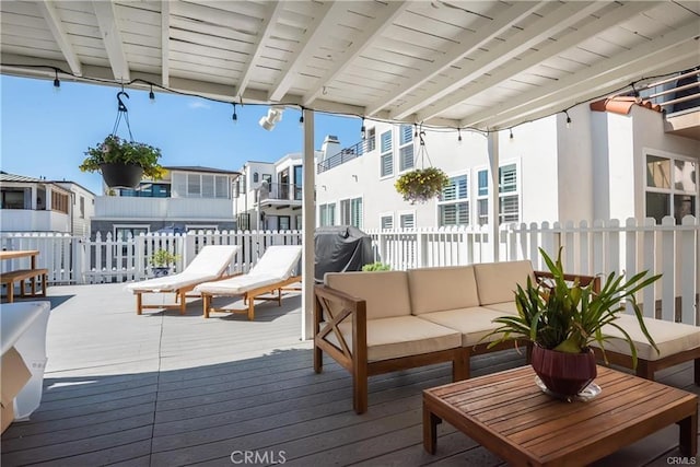 wooden deck featuring a grill and outdoor lounge area