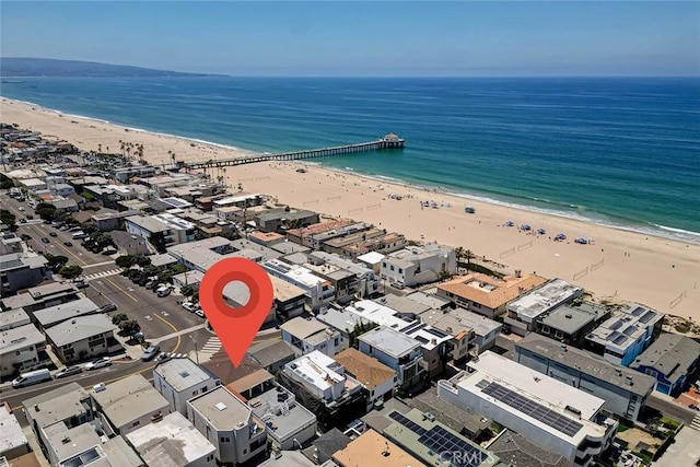 drone / aerial view with a water view and a view of the beach