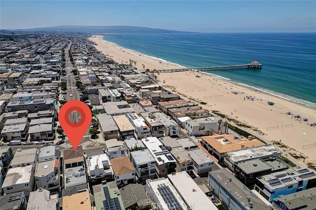 aerial view with a water view and a view of the beach