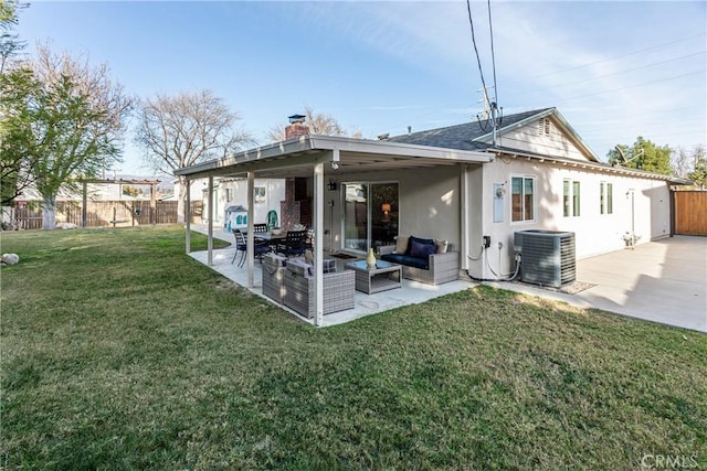 back of property with an outdoor hangout area, a patio area, cooling unit, and a lawn