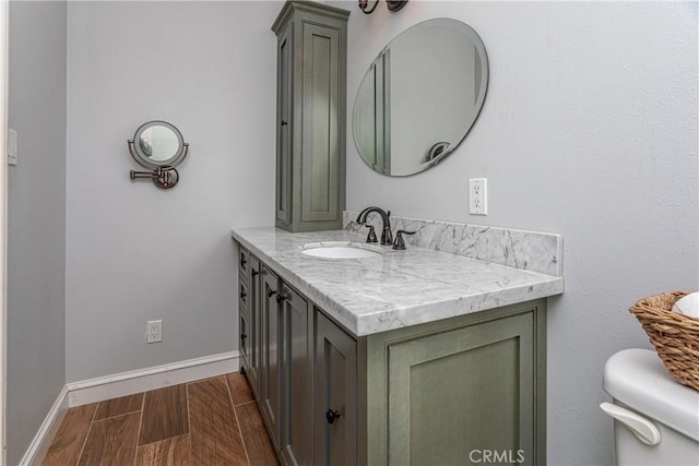 bathroom with toilet and vanity