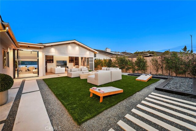 view of yard with an outdoor living space and a patio