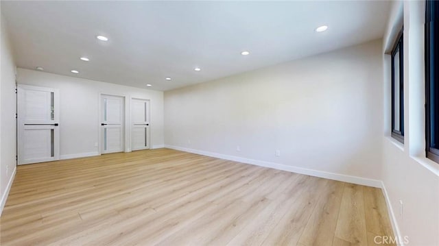 unfurnished room featuring light hardwood / wood-style floors