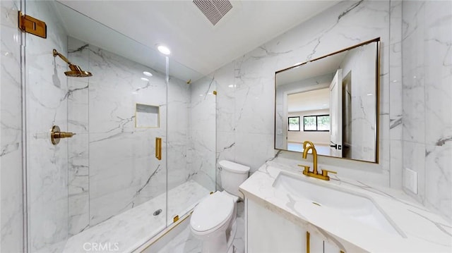 bathroom featuring vanity, tile walls, an enclosed shower, and toilet