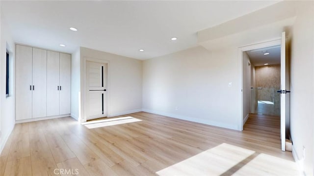 unfurnished bedroom with light hardwood / wood-style flooring