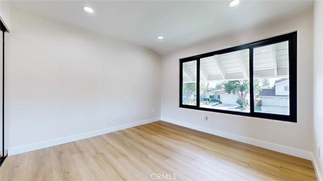 unfurnished room featuring light hardwood / wood-style floors