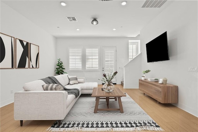 living room with light hardwood / wood-style floors