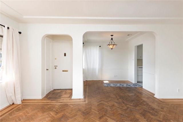 unfurnished room featuring parquet flooring