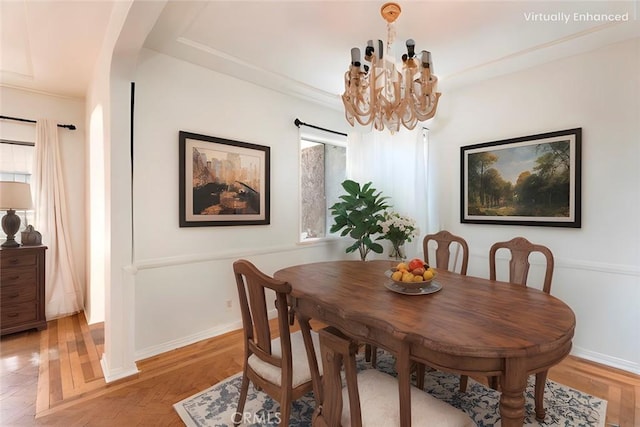 dining area with a chandelier and hardwood / wood-style floors