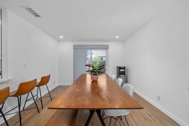 dining room with light hardwood / wood-style floors