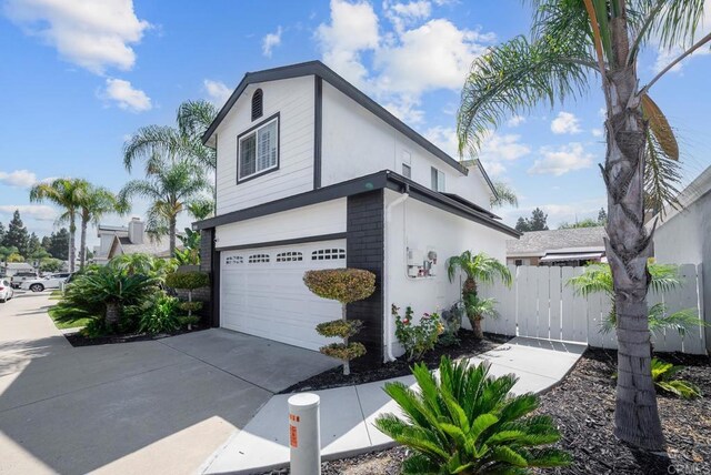 view of side of home with a garage