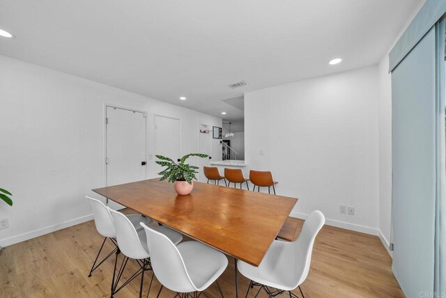 dining area with light wood-type flooring