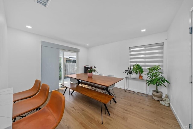 dining room with light wood-type flooring