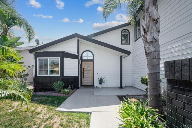 property entrance with a patio area