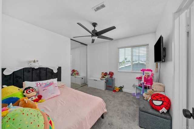 carpeted bedroom with ceiling fan