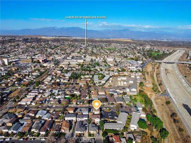 birds eye view of property featuring a mountain view