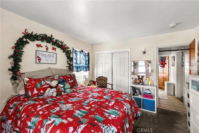 carpeted bedroom with a closet