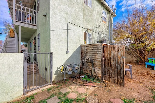 view of home's exterior with a balcony