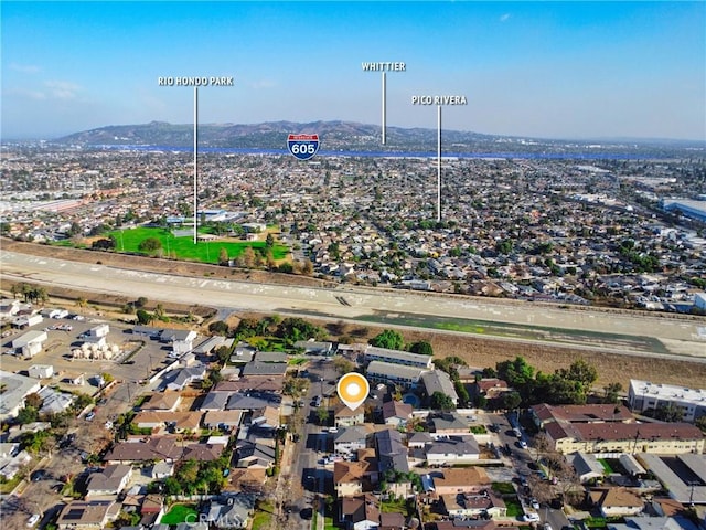 birds eye view of property with a mountain view