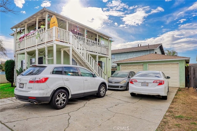 view of front facade featuring covered porch and a garage