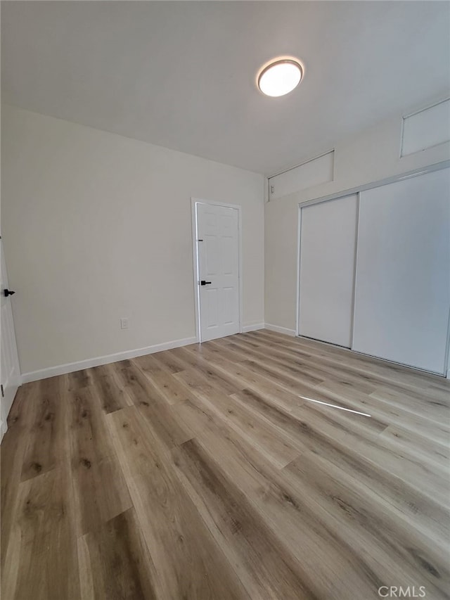 empty room with light wood-type flooring