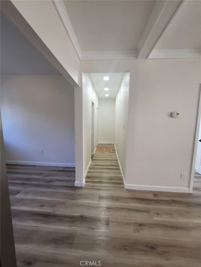 corridor featuring ornamental molding and dark hardwood / wood-style floors