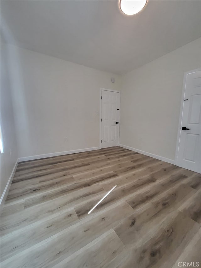 empty room with light wood-type flooring