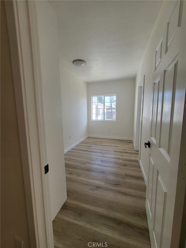 unfurnished room with light hardwood / wood-style flooring