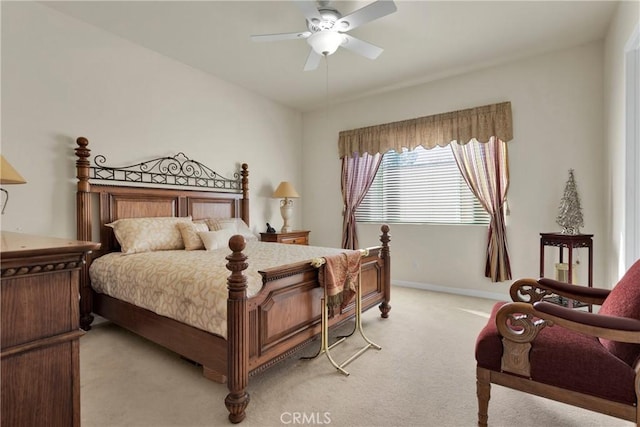 bedroom featuring light carpet and ceiling fan