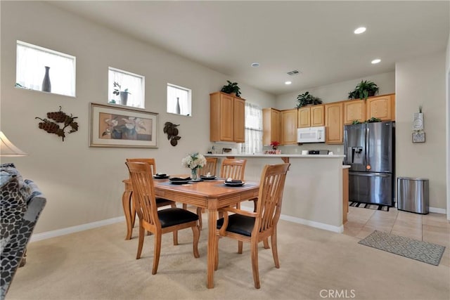 view of carpeted dining space