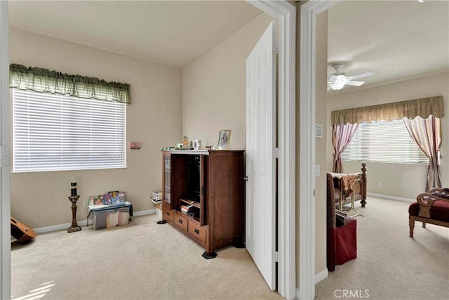 miscellaneous room with ceiling fan and light colored carpet