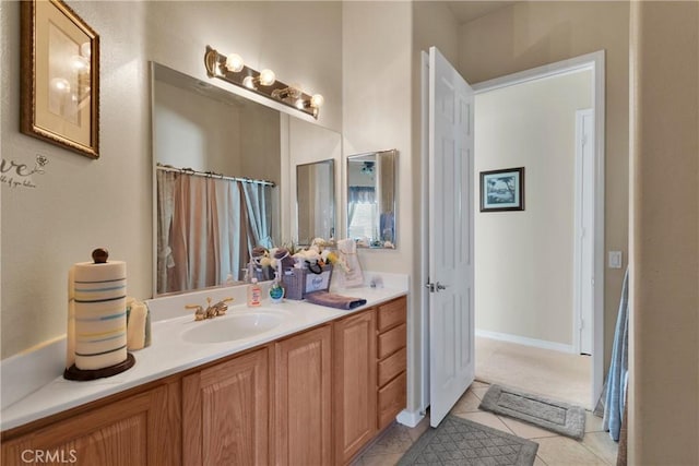 bathroom with tile patterned flooring and vanity