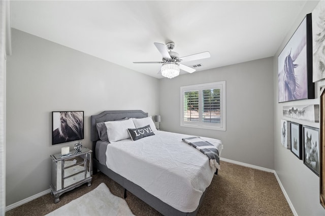 bedroom with ceiling fan and dark colored carpet