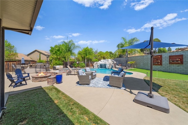 view of patio / terrace featuring an outdoor fire pit, pool water feature, and a fenced in pool