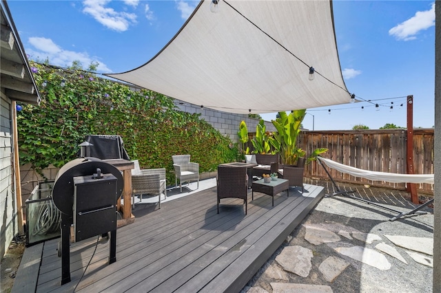 wooden deck with an outdoor hangout area