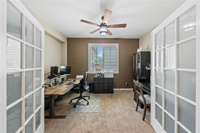 office with ceiling fan, light carpet, and french doors