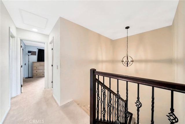 hallway with a chandelier