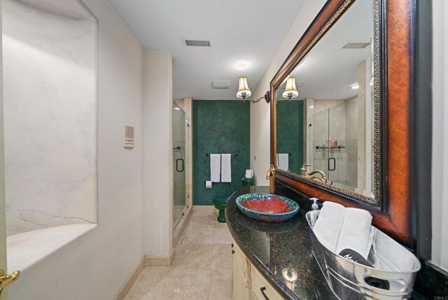 bathroom featuring an enclosed shower and vanity