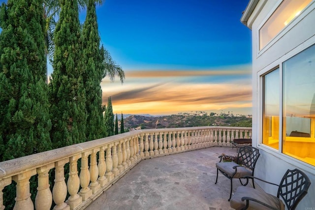 view of balcony at dusk