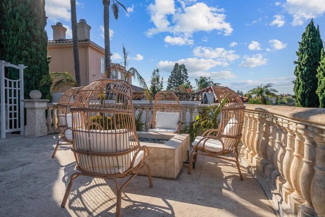 view of patio / terrace featuring a fire pit