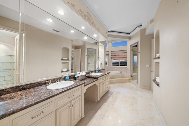 bathroom with vanity, ornamental molding, and plus walk in shower