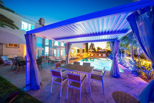 view of patio terrace at dusk