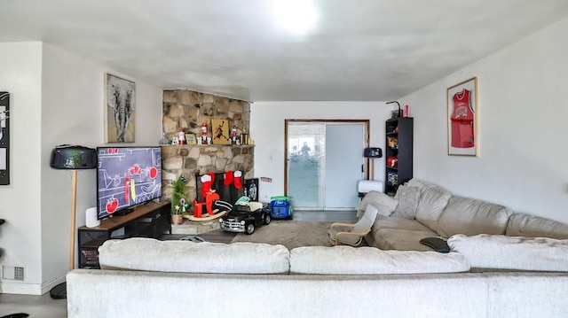 living room featuring a fireplace