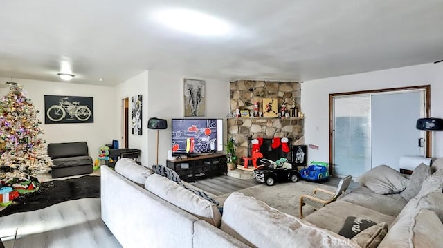 living room featuring hardwood / wood-style flooring and a fireplace