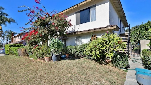 view of side of property featuring a yard