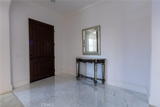 foyer entrance featuring crown molding