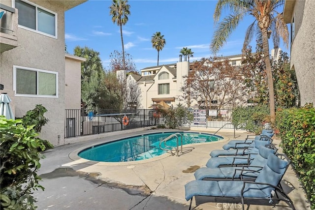 view of swimming pool with a patio area