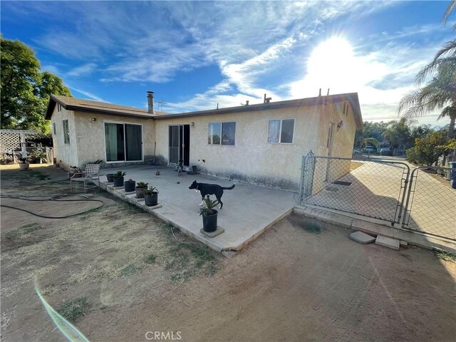 rear view of property with a patio area