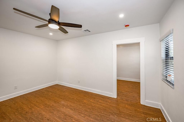 spare room featuring ceiling fan and hardwood / wood-style flooring